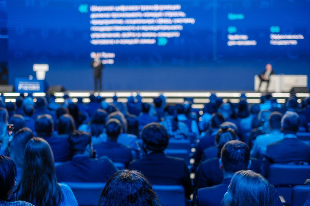 A crowd of people at a corporate event