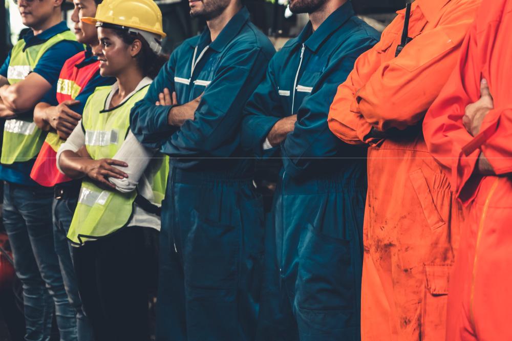 A group of industrial employees on strike at their manufacturing facility
