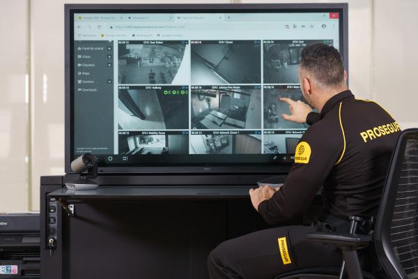 A Prosegur security officer reviewing workplace security footage