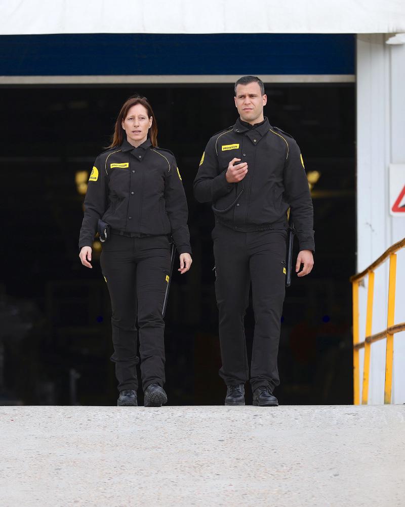 Two Prosegur security guards providing security guard services for a logistics warehouse