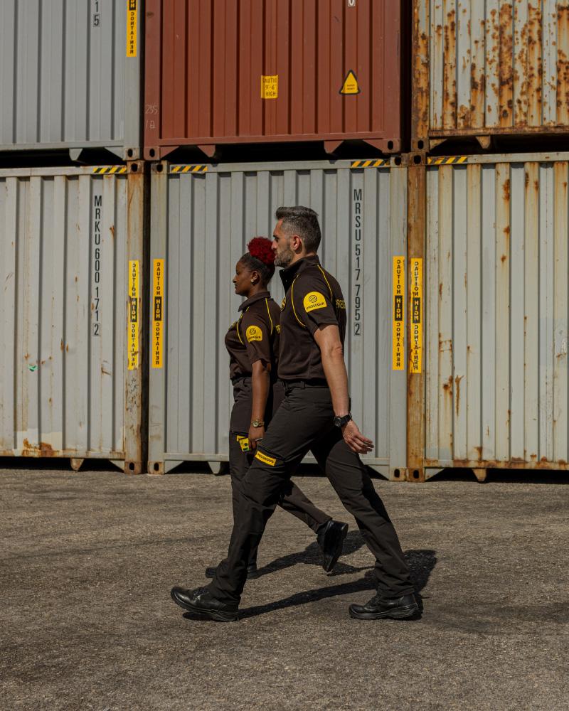 Two Prosegur security guards walking their port security patrol