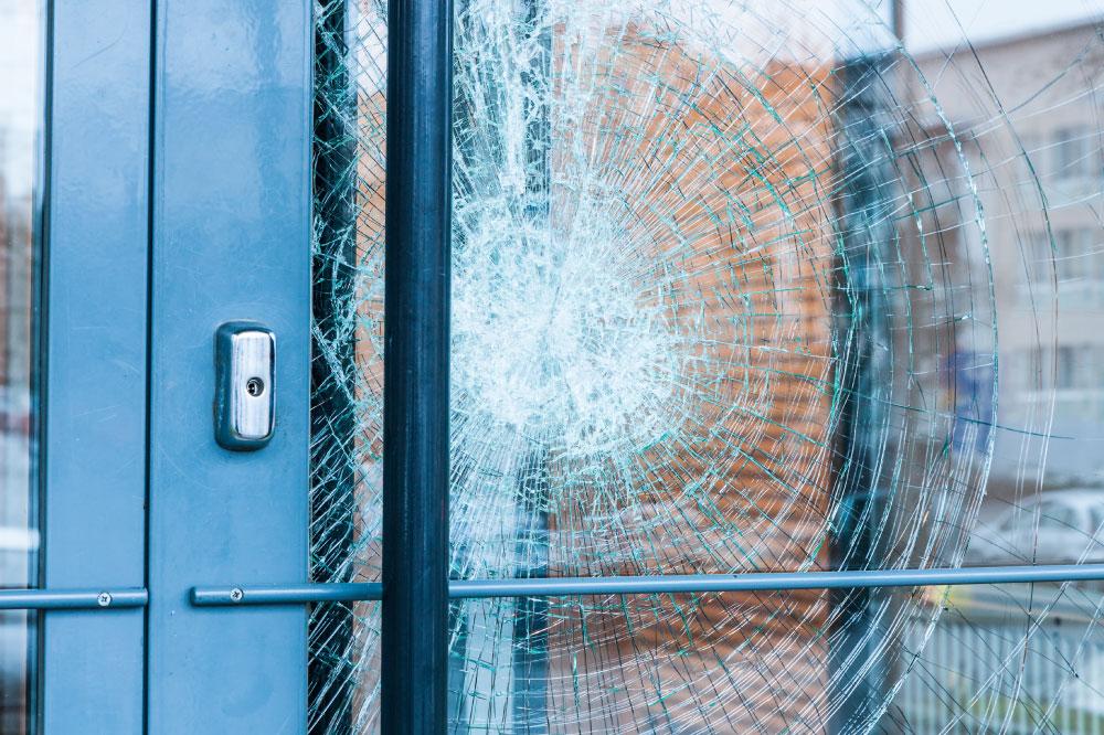 A broken window at a residential building