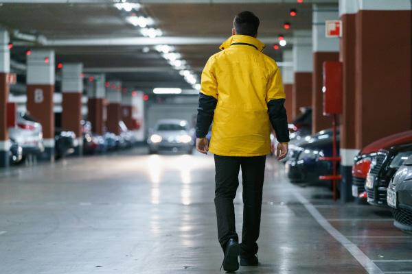 Residential Guarding Patrol A Prosegur security officer on patrol in a residential parking lot
