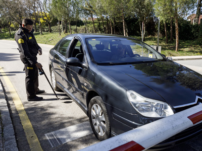 Security officer inspecting a vehicle