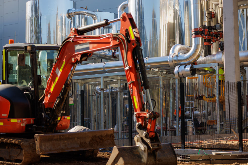 A data center under construction with an excavator